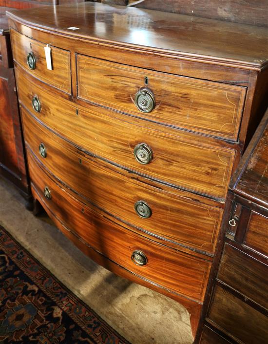Regency mahogany satinwood cross-banded and line-inlaid bow-fronted chest of drawers(-)